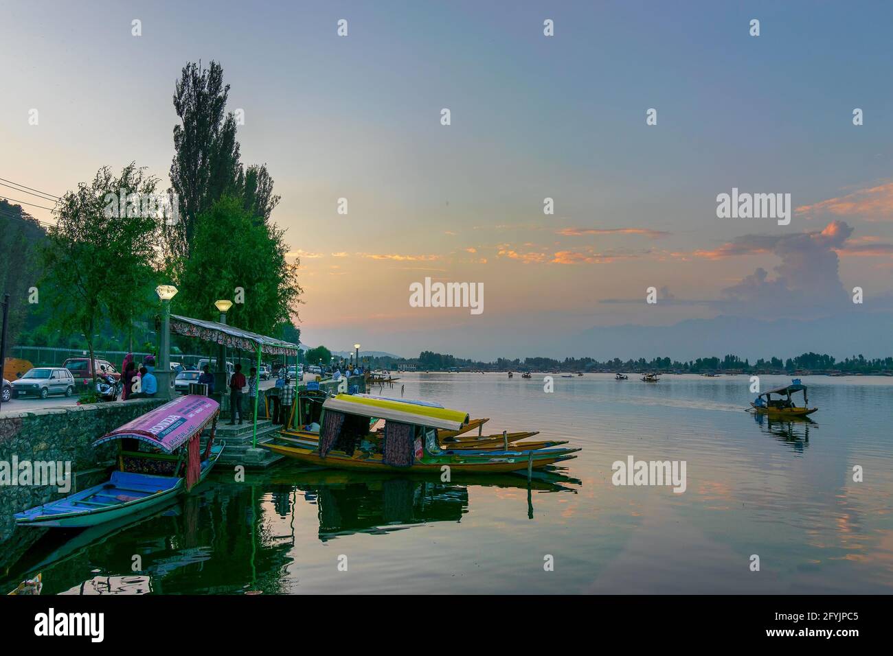 Shree Nagar,Jammu and Kashmir,India-31st August 2014 :Beautiful Dal lake after sunset, houseboats floating on water with evening sky in the background Stock Photo