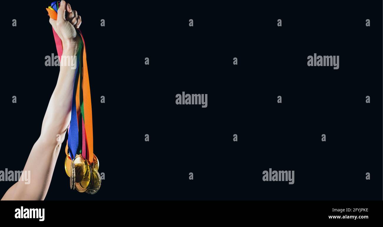 Composition of caucasian female athlete holding medals with copy space ...