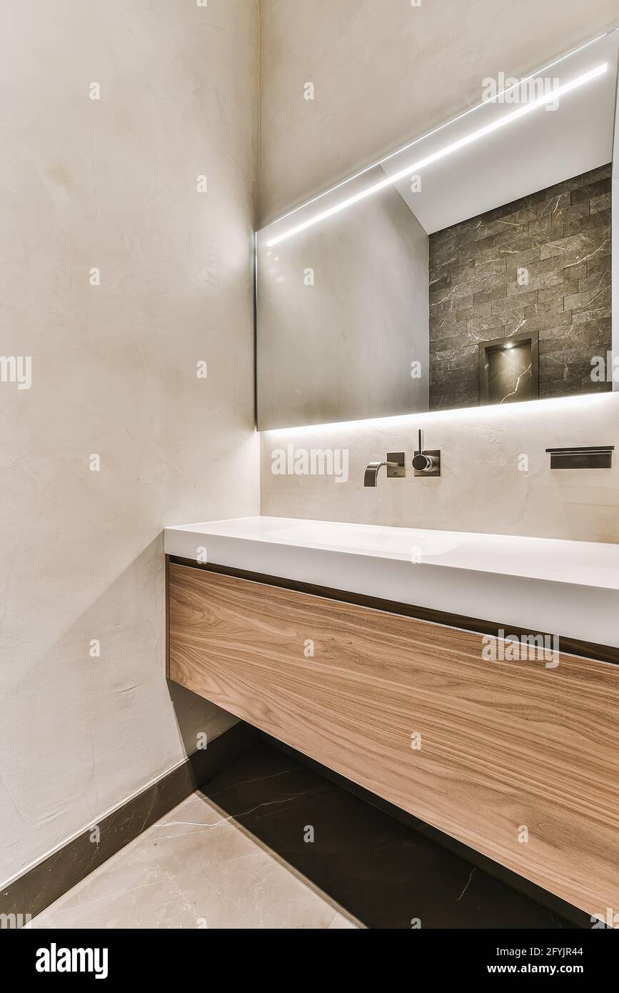 Minimalist wooden with double washbasins and wall mount faucets