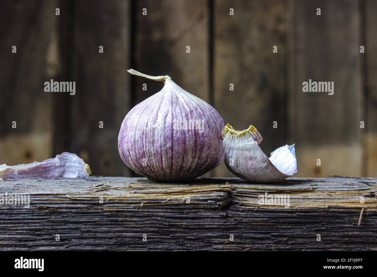 Garlic close up, Garlic bulb, Garlic cloves on wooden ground Stock