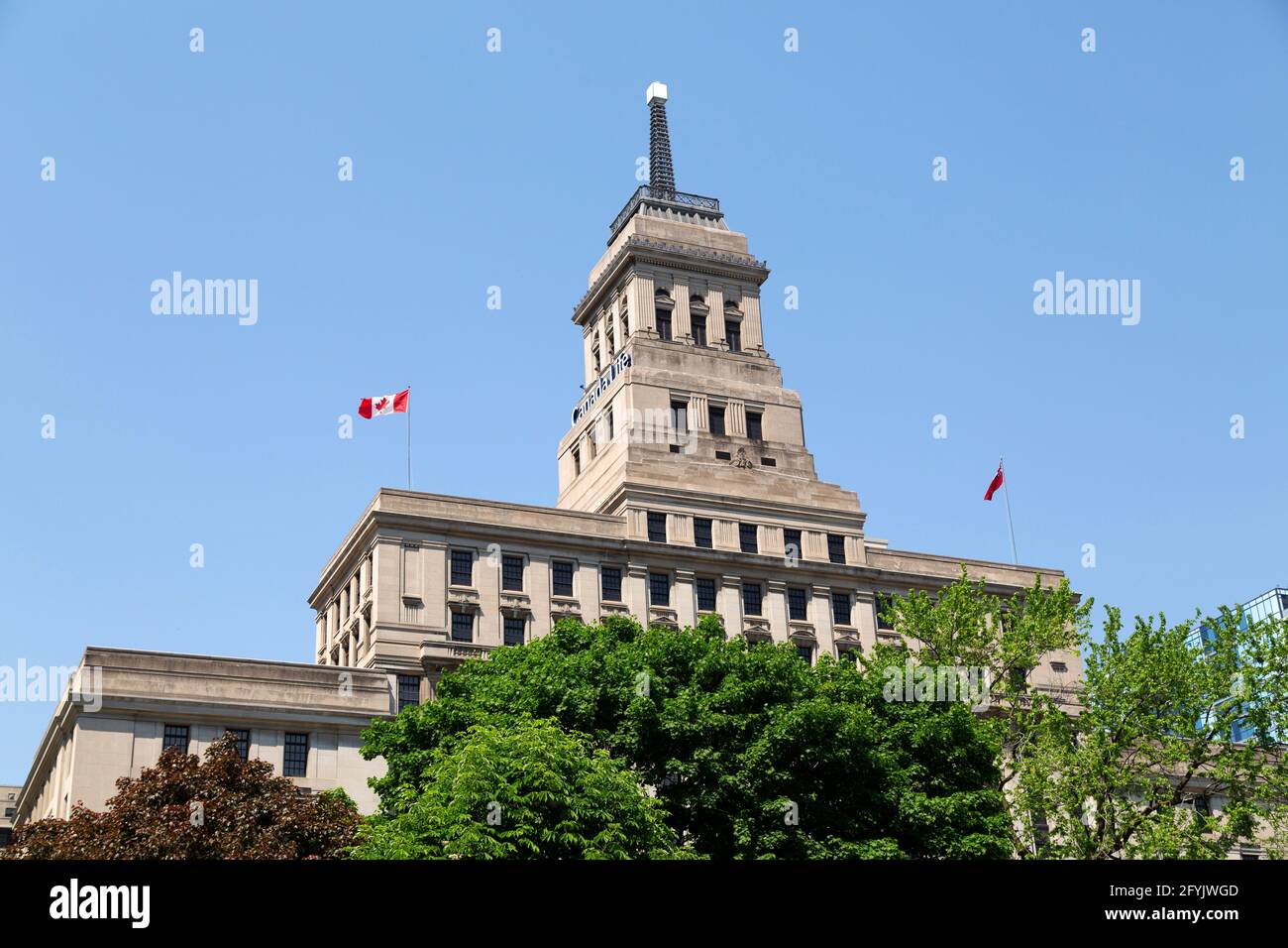 The Canada Life Building in downtown Toronto in Ontario, Canada. The beacon on its rooftop is indicative of the weather. Stock Photo