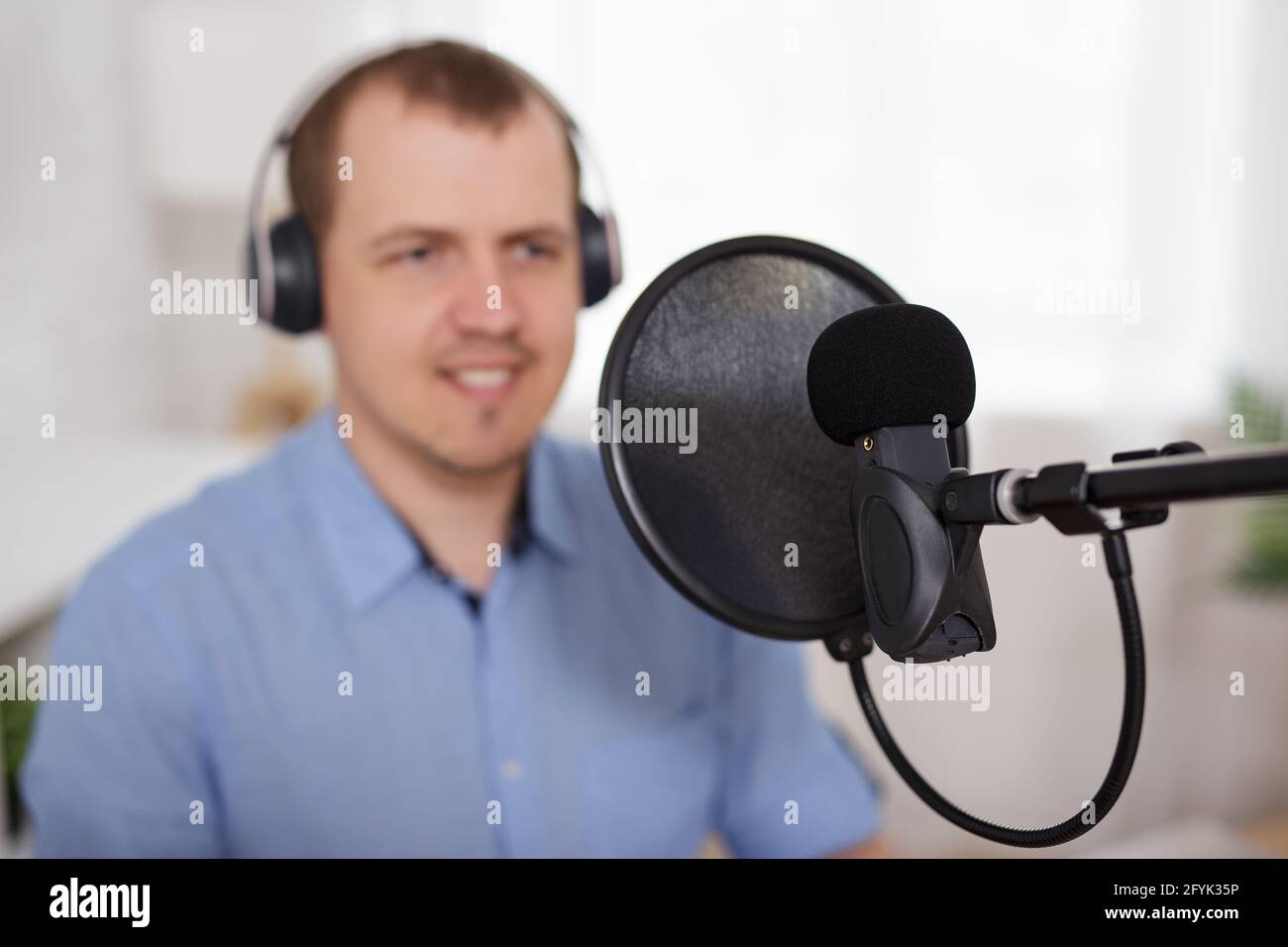 Commentator talking speaking into microphone hi-res stock photography ...