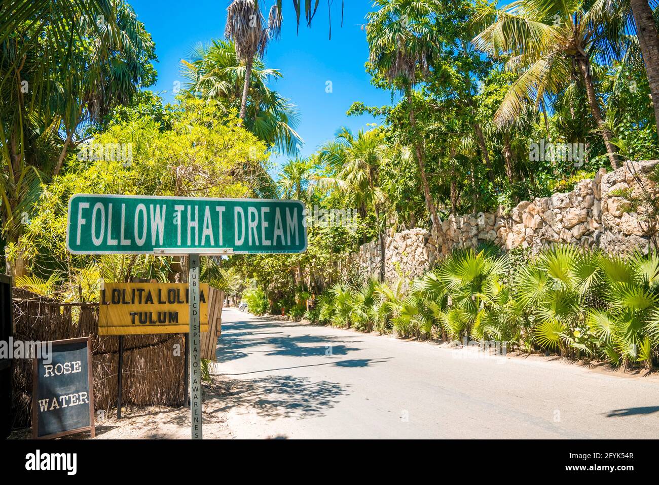 Follow that dream sign by the side of the road. Stock Photo