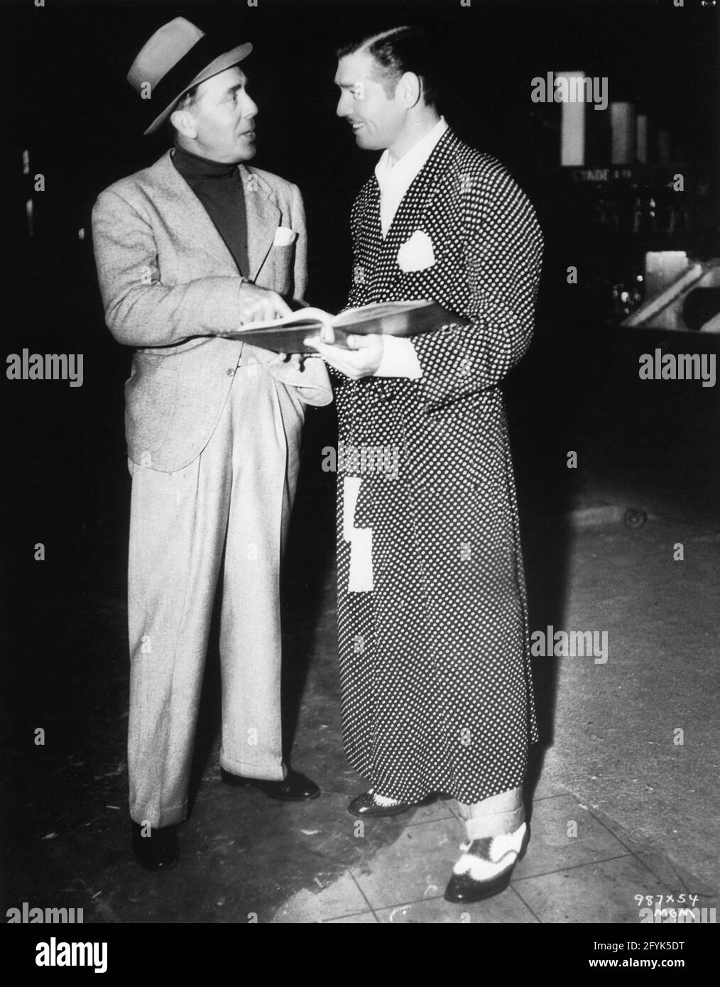 Director JACK CONWAY and CLARK GABLE on set candid during filming of ...