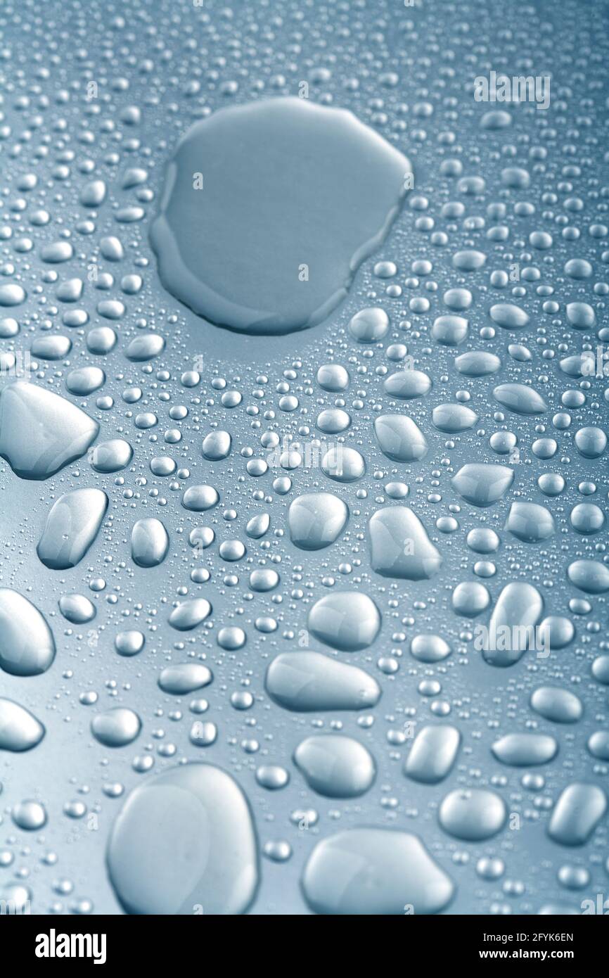 transparent, pure water drops on metallic surface Stock Photo