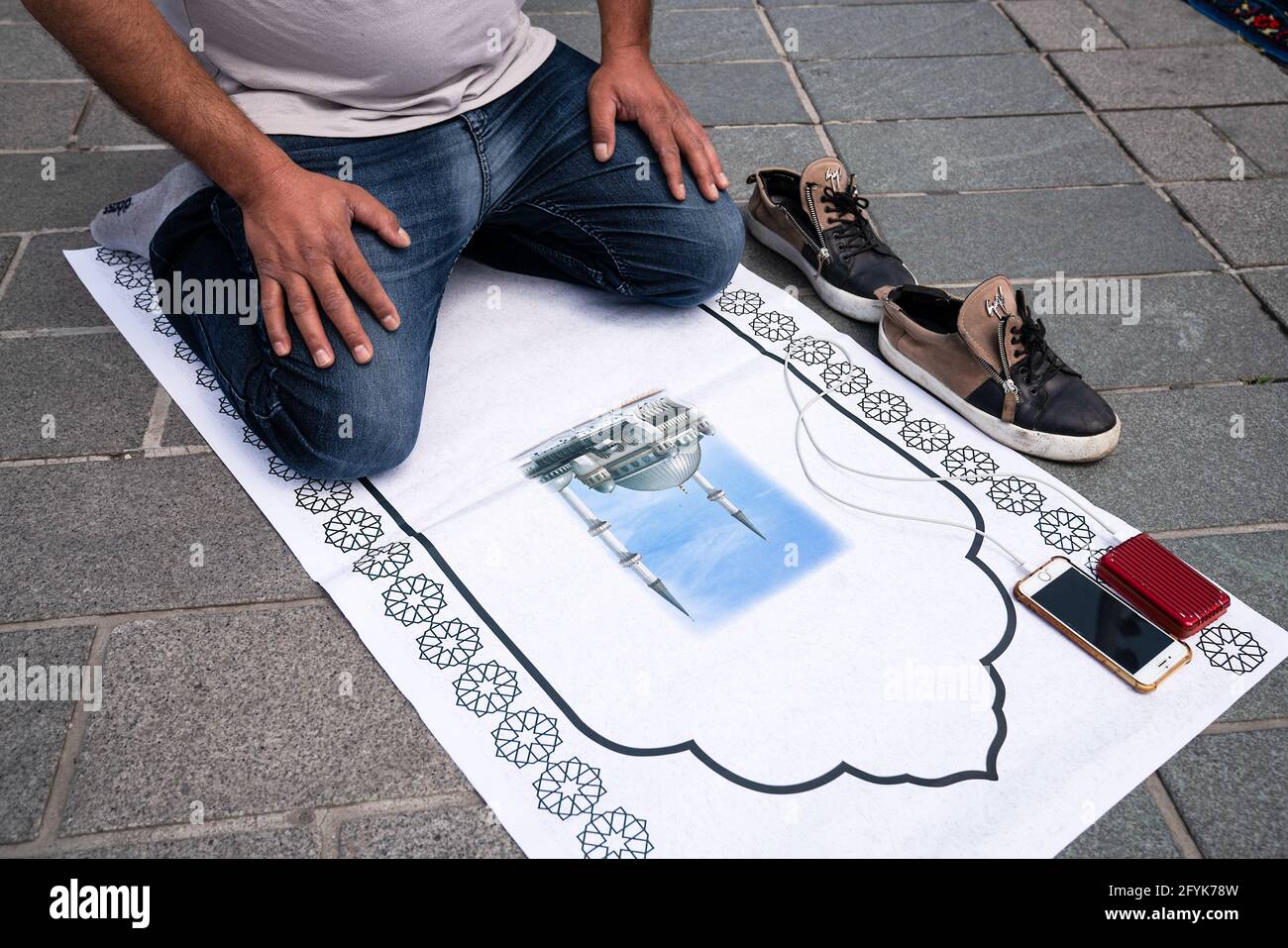 Istanbul, Turkey. 28th May, 2021. A man attends the Friday prayers outside the Taksim Mosque. Turkish President Recep Tayyip Erdogan inaugurated the newly built Taksim Mosque in Istanbul's main square. (Photo by Murat Baykara/SOPA Images/Sipa USA) Credit: Sipa USA/Alamy Live News Stock Photo