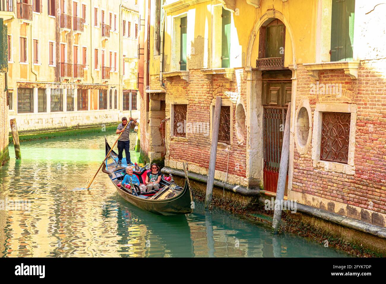 Venice Italy May 9 21 Close Up On Traditional Boats And Gondoliers On Canals Of Venice Through Venetian Roads Italian City Of Unesco Heritage Stock Photo Alamy