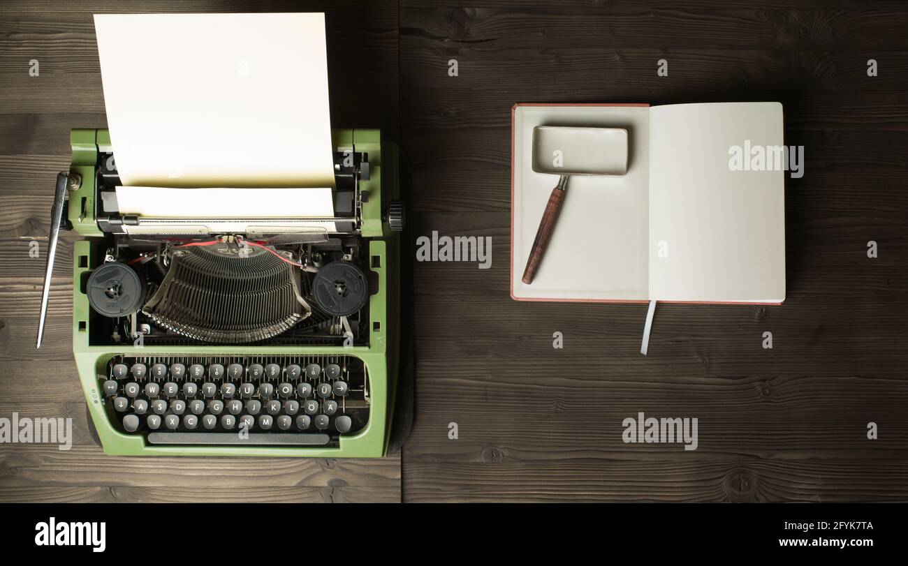 vintage typewriter and magnifier on handbook Stock Photo