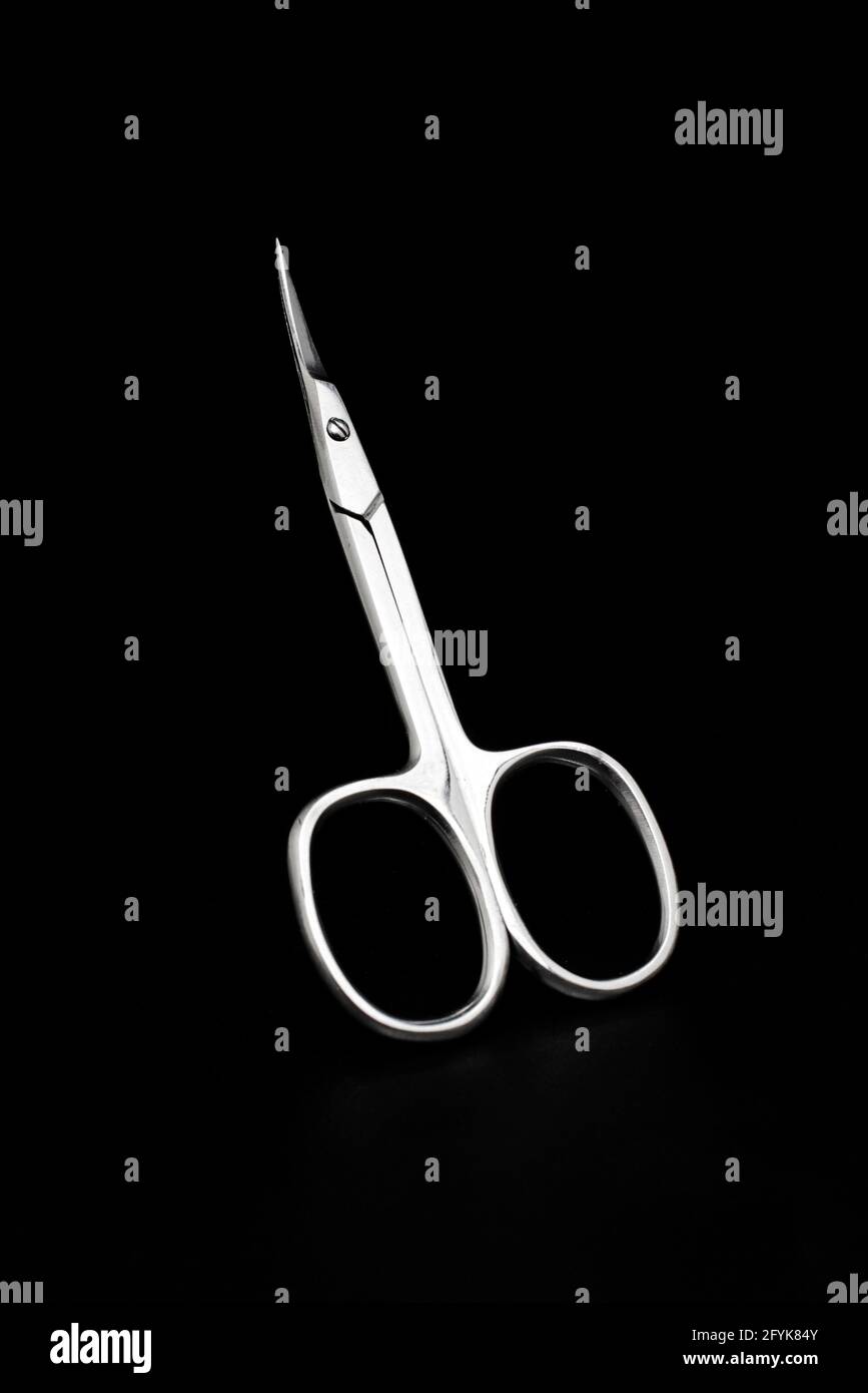 metal manicure scissors isolated on black Stock Photo