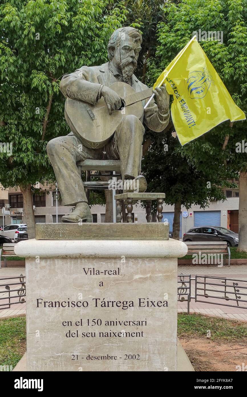 monument to the Spanish pedagogical guitarist composer Francisco Tarrega with the flag of Villarreal Club de Fútbol, champion of the Europa League Stock Photo
