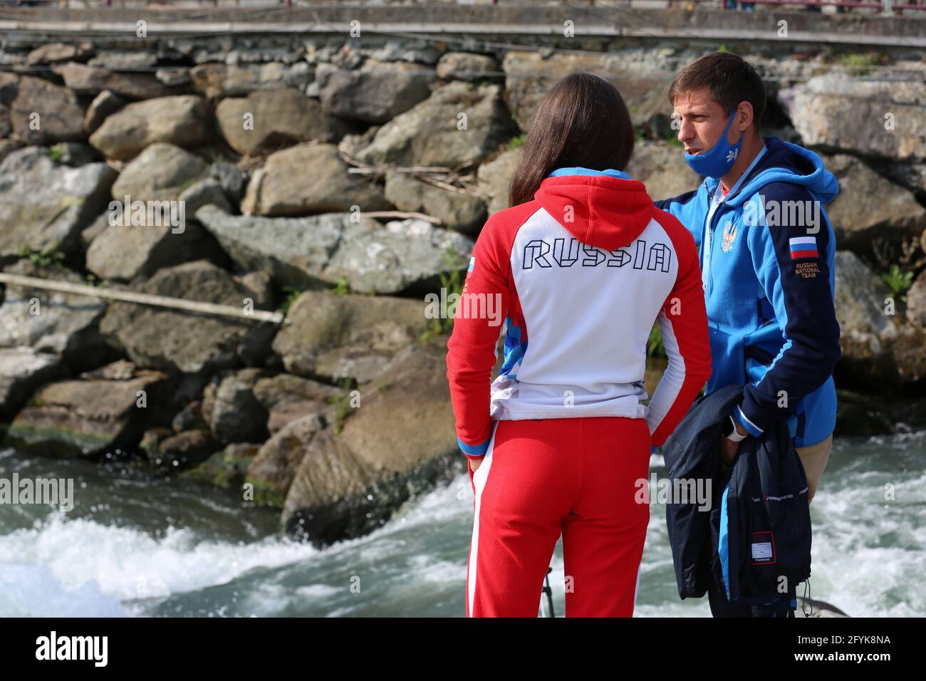 Zulfiia SABITOVA of Russia talks with her coach before competing in the semifinals of the ECA Canoe Slalom C1 European Championships on the Dora Balte Stock Photo