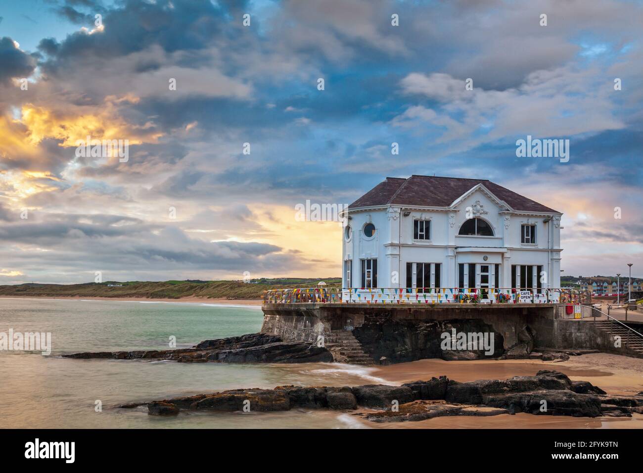 Sunset at the Arcadia, a historic cafe and former ballroom on the coast at Portrush, a small seaside resort town in County Antrim, Northern Ireland. Stock Photo