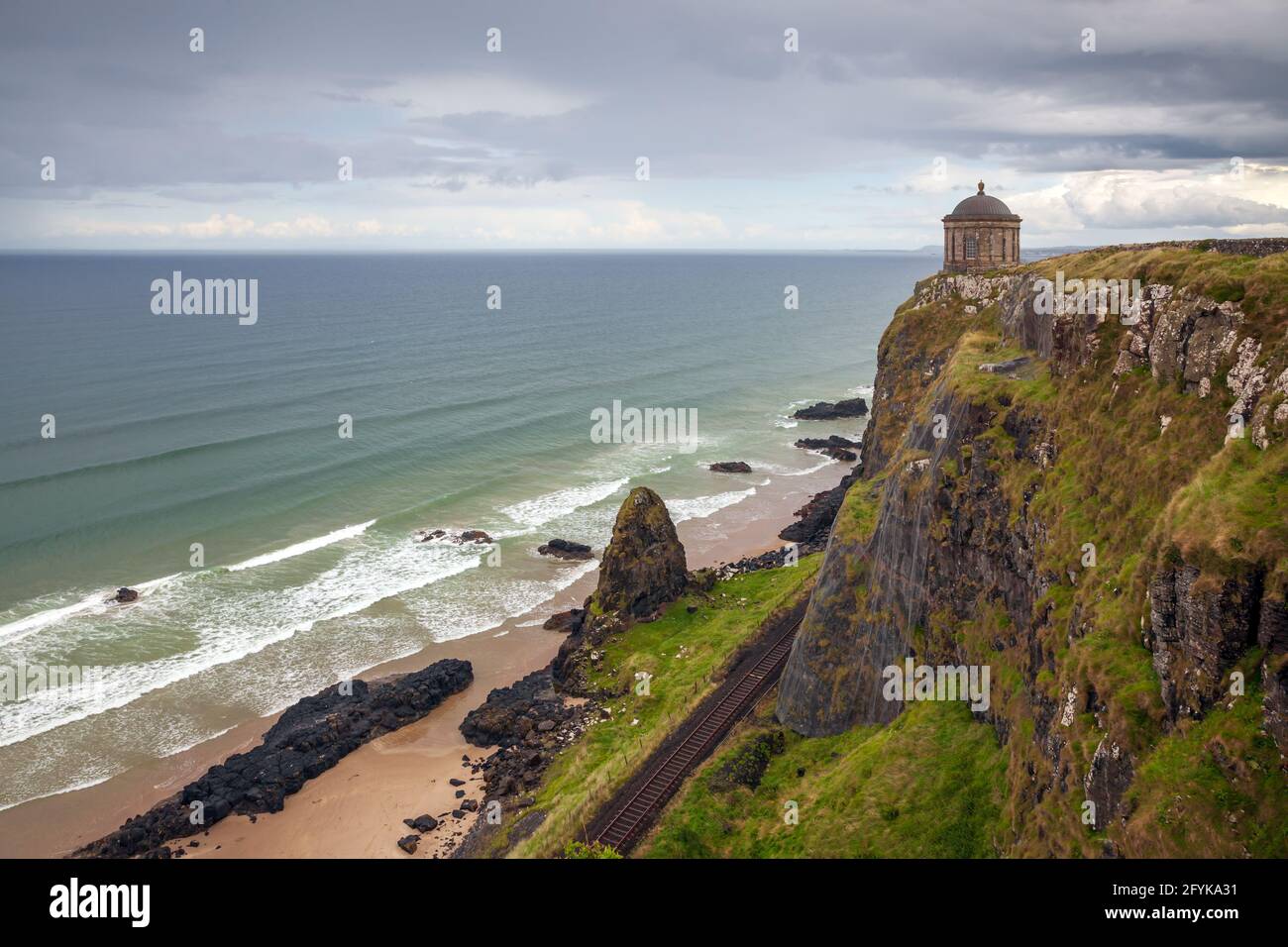 The Mussenden temple is perched on the cliffs overlooking Downhill Strand and located on the Causeway coastal route at Castlerock, County Londonderry. Stock Photo