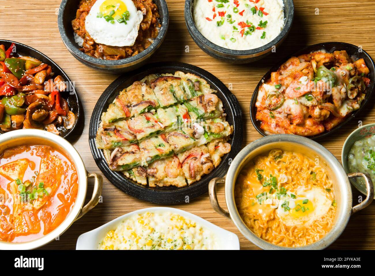 A menu selection of traditional Korean dishes at an Asian restaurant