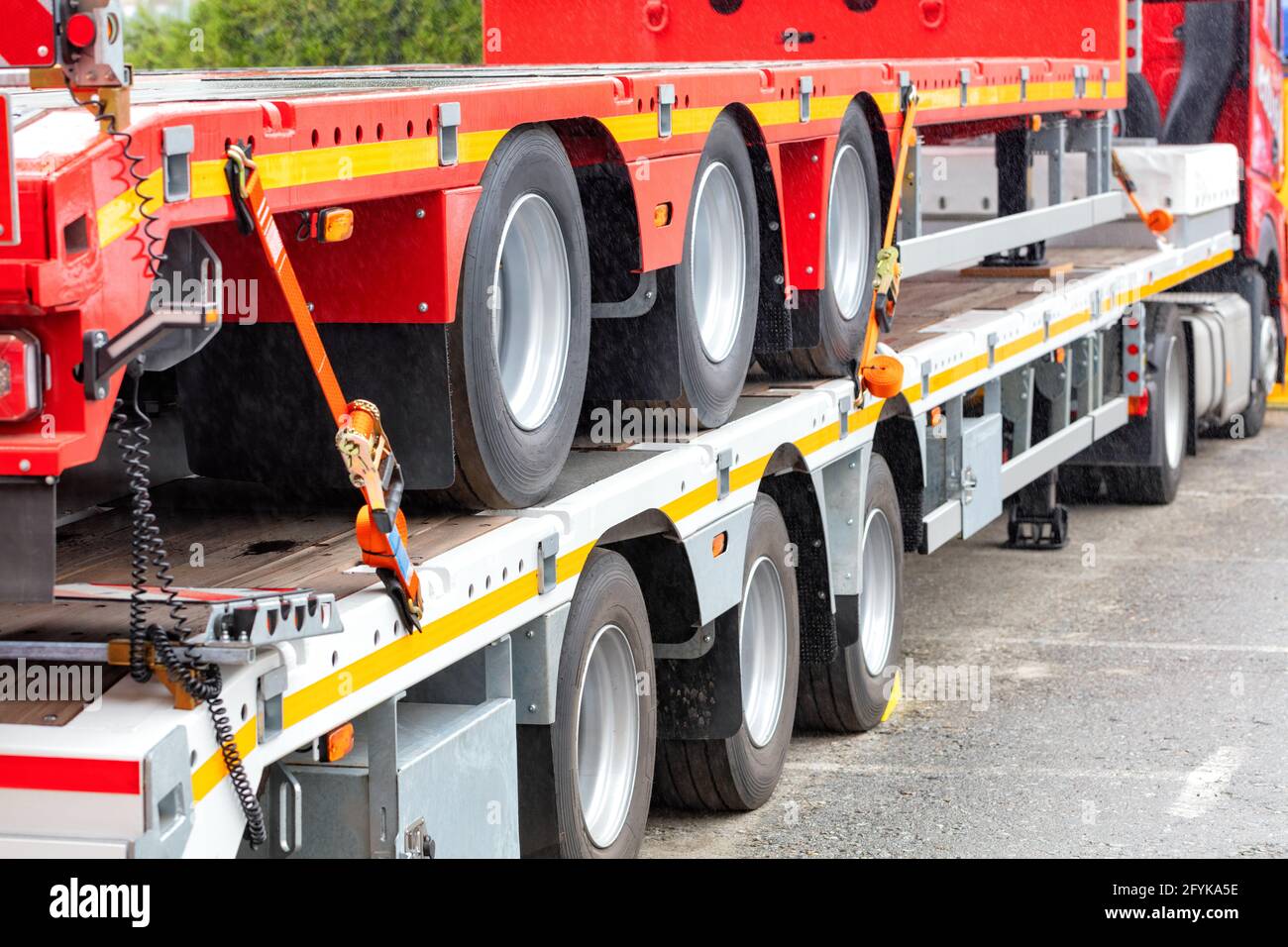 Truck vehicle platforms, heavy duty anchorage with ratchet fixing strap