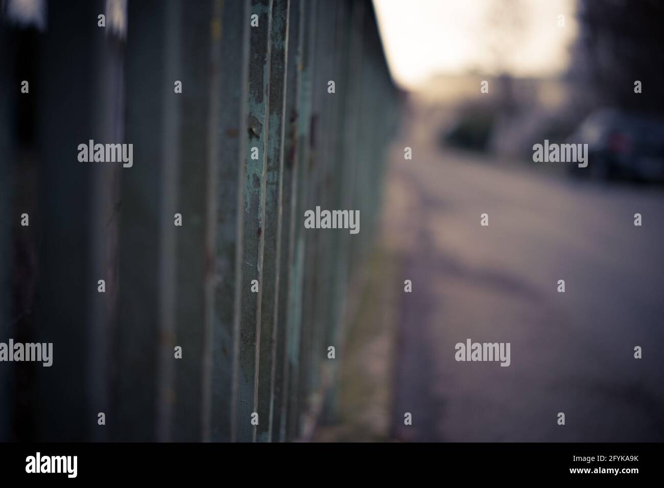 Closeup shot f an old rusty metal fence in the street Stock Photo - Alamy