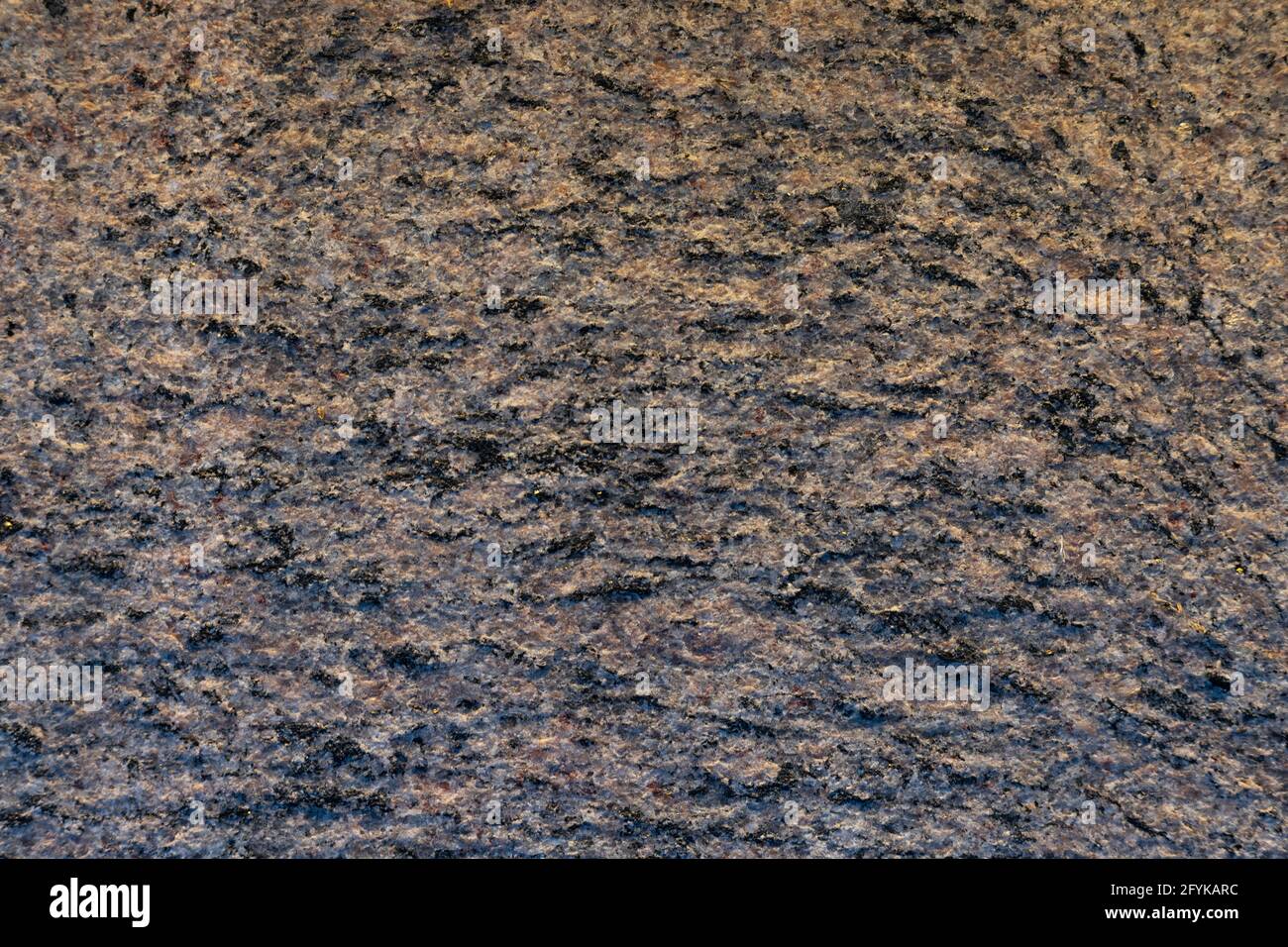 Gray and brown stone granite textured abstract wall background. Stock Photo
