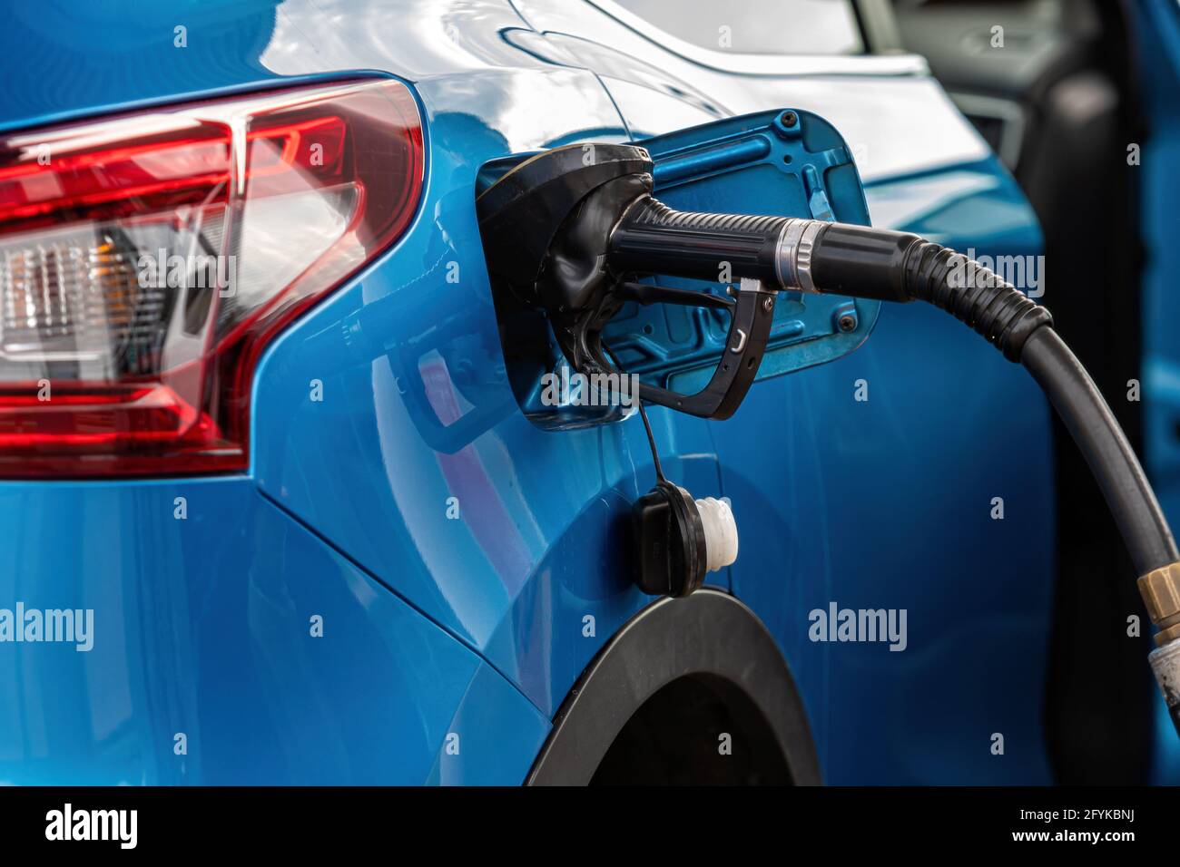 refueling Car fill with petrol gasoline at gas station and petrol pump