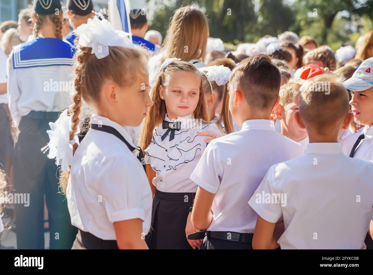 Kerch Russia - September 1, 2020 - children go to school, first bell,  childrens in school uniforms, teachers and parents in the background near  the sc Stock Photo - Alamy