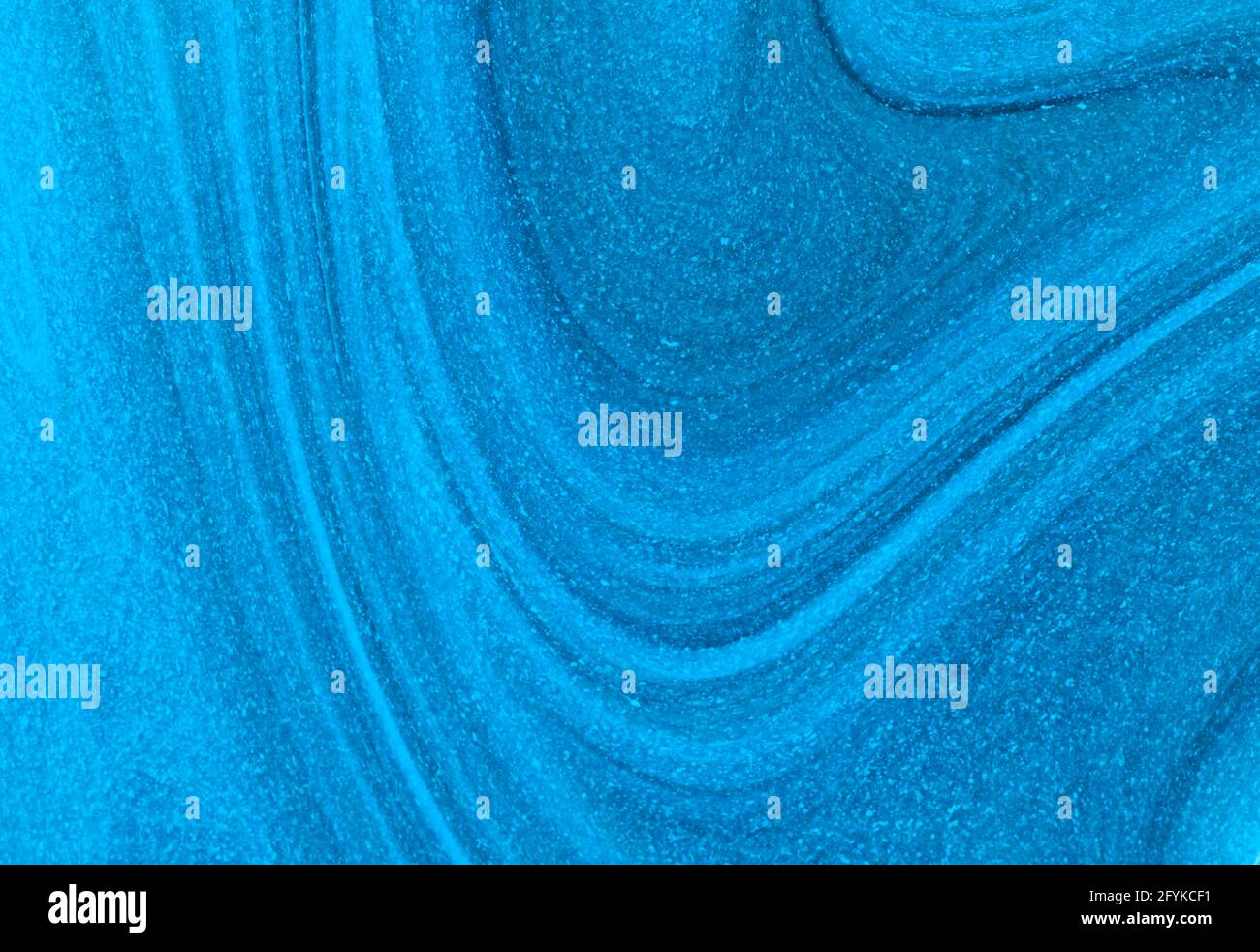 Abstract Blue Paint Swirling with Speckles Stock Photo - Alamy