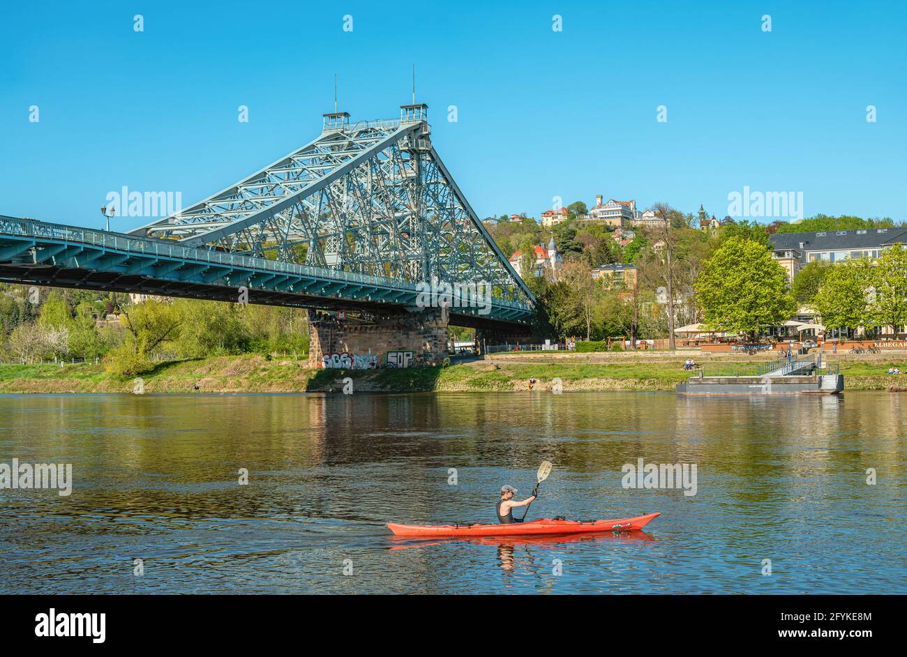 Canoeist on the Elbe River near Blaues Wunder Bridge of Dresden, Saxony, Germany Stock Photo
