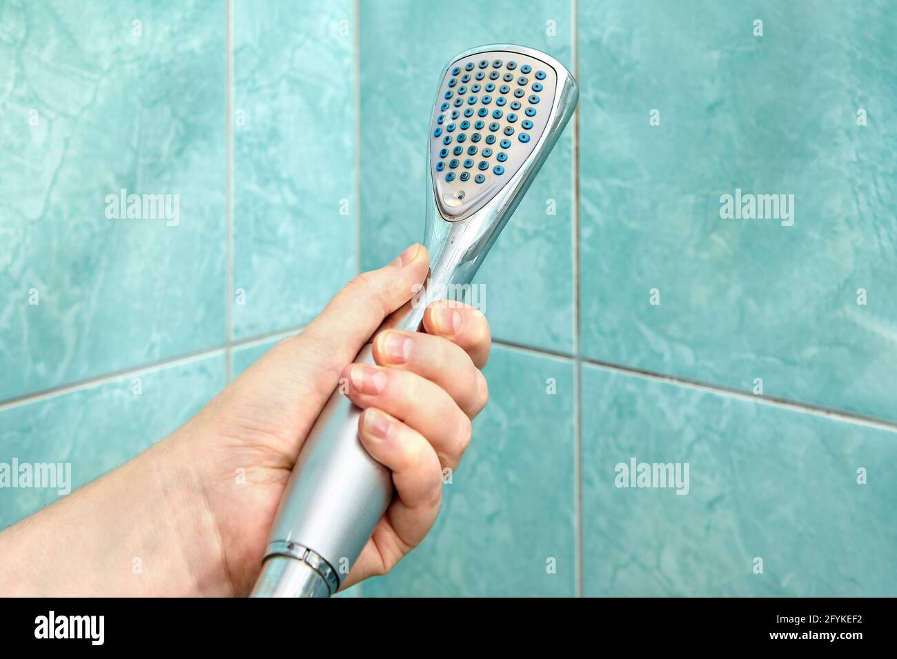 Shower head is clogged and must be replaced with new one Stock Photo