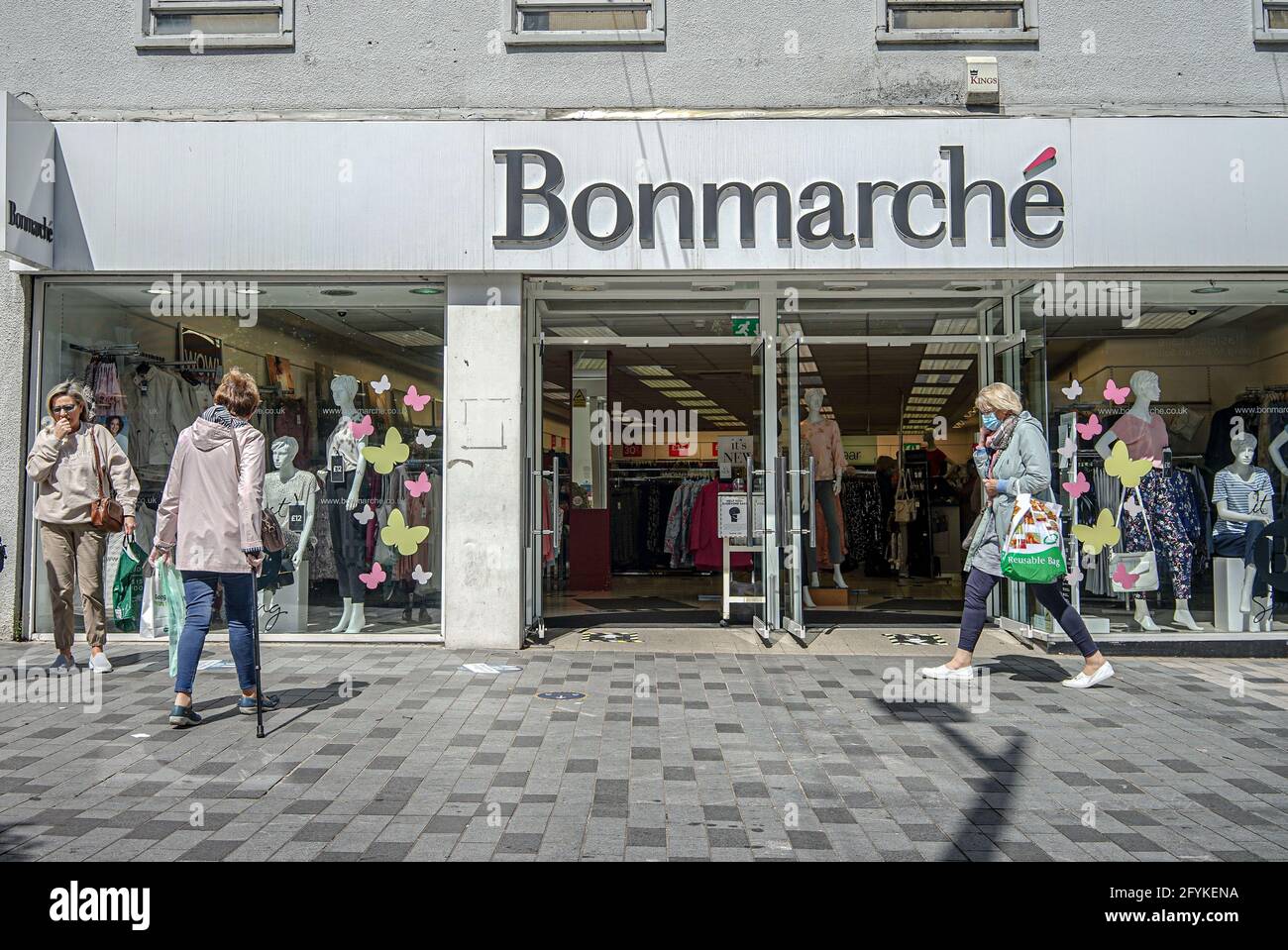 Shoppers pass by Bonmarche Clothes Store on Bow St Stock Photo - Alamy