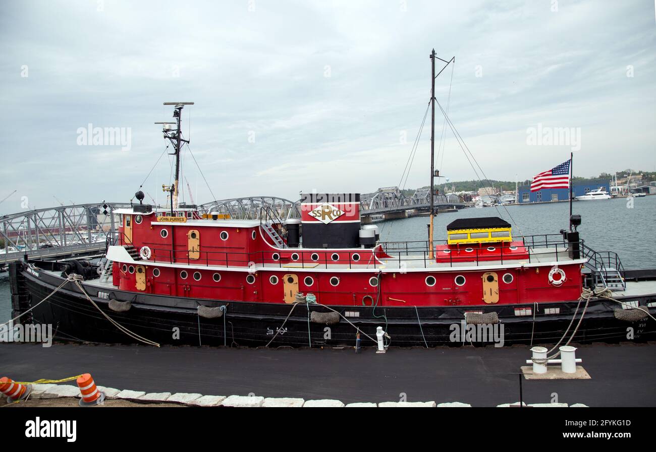 The historic tug John Purves sits in the water as part of the Door County Maritime Museum Sturgeon Bay Wisconsin Stock Photo