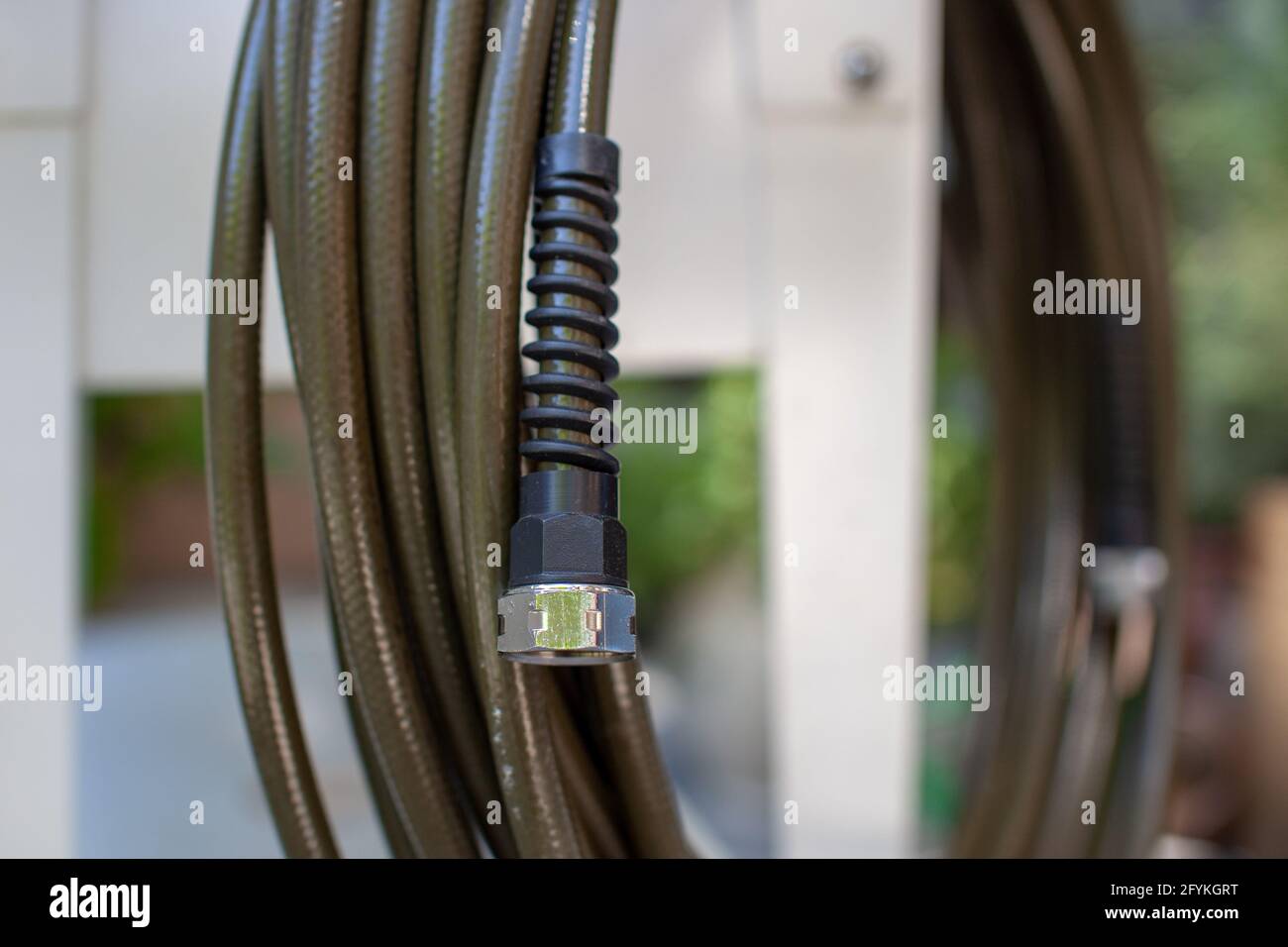 A close up view of a stainless steel hose fitting, to prevent the