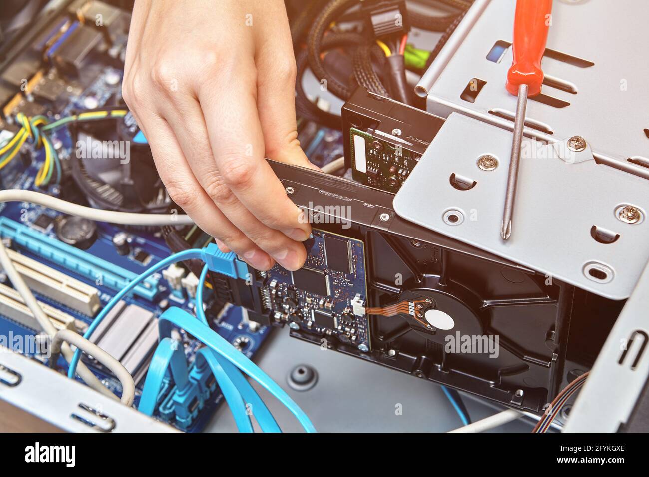 Mounting computer hard drive inside system unit Stock Photo - Alamy