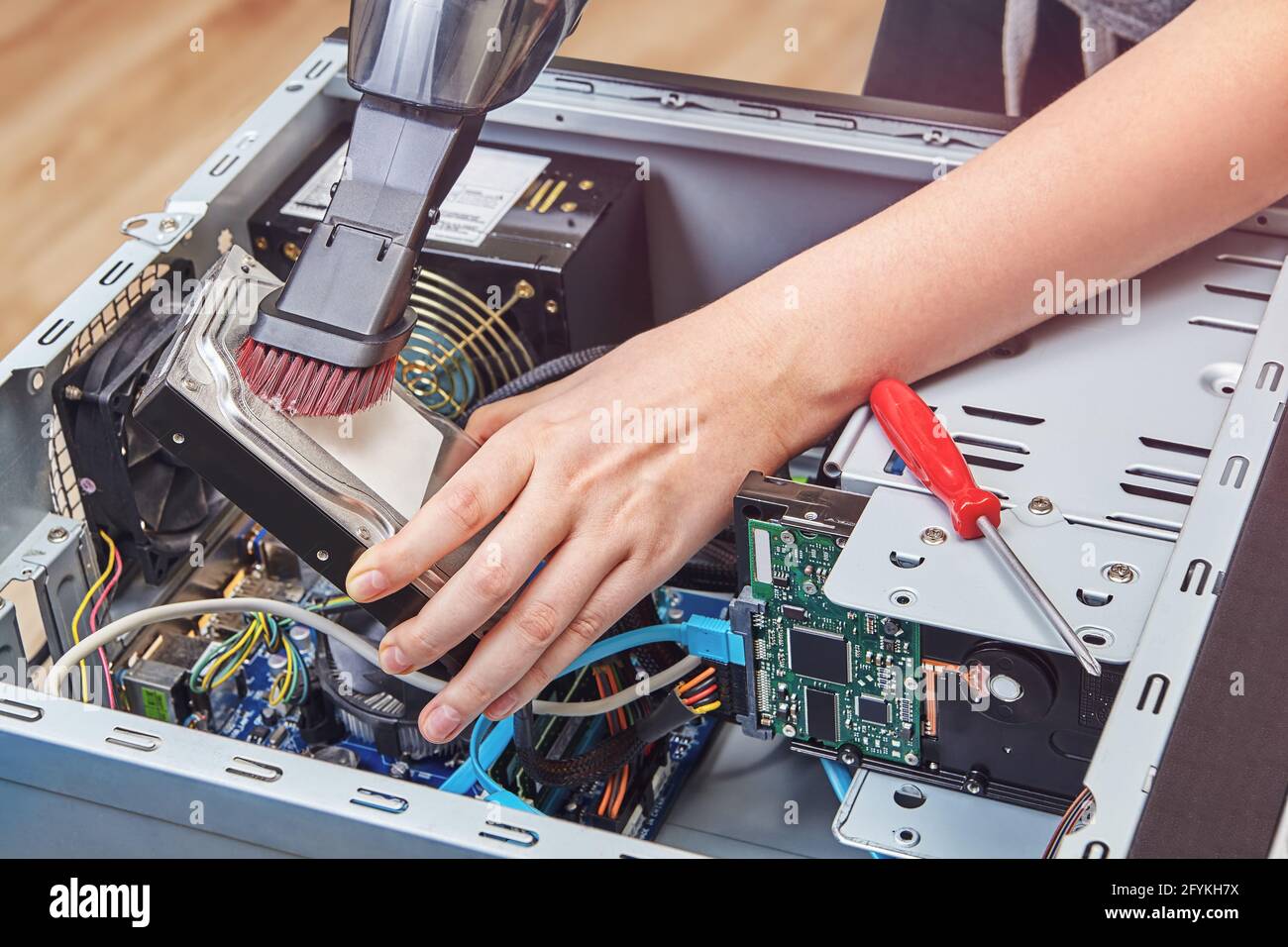 Remove dust from hard disk drive of desktop PC using vacuum cleaner Stock  Photo - Alamy