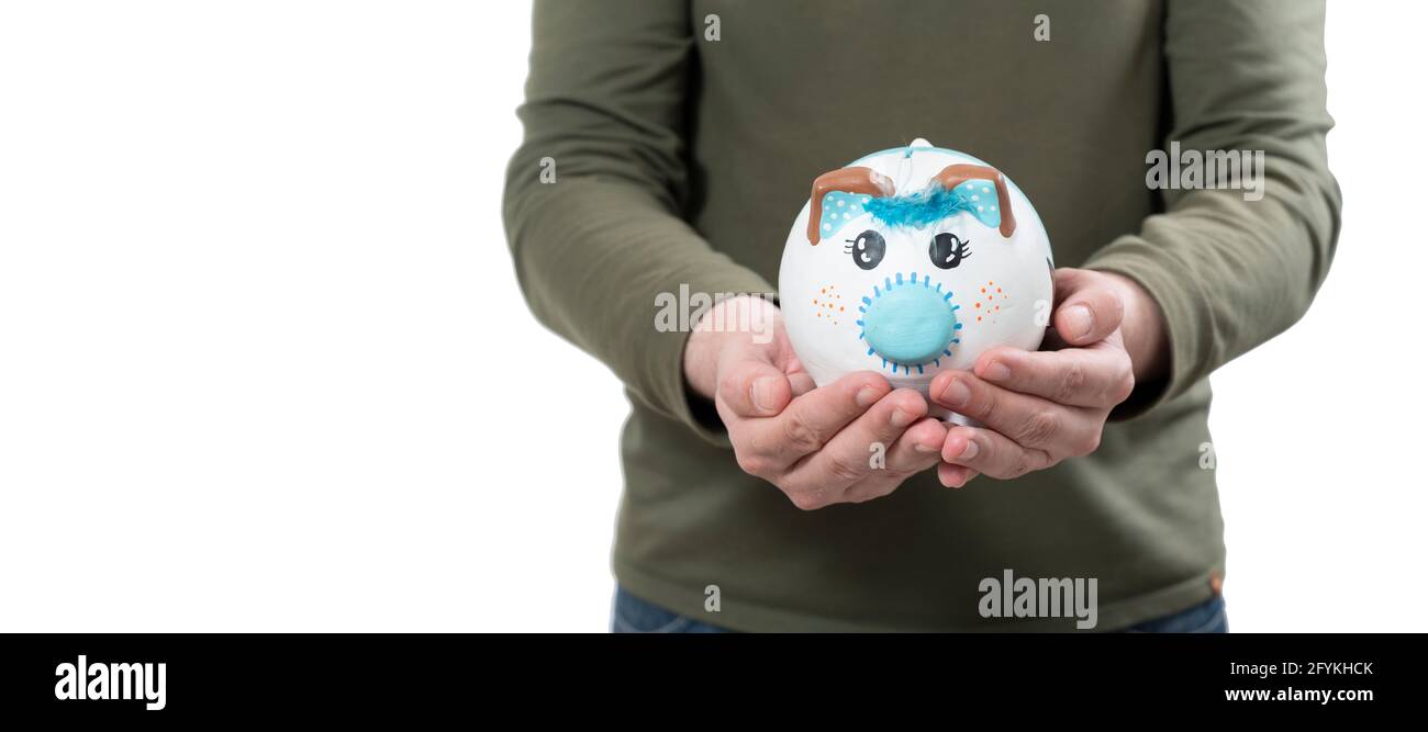 man holding in his hands a pig-shaped piggy bank Stock Photo - Alamy