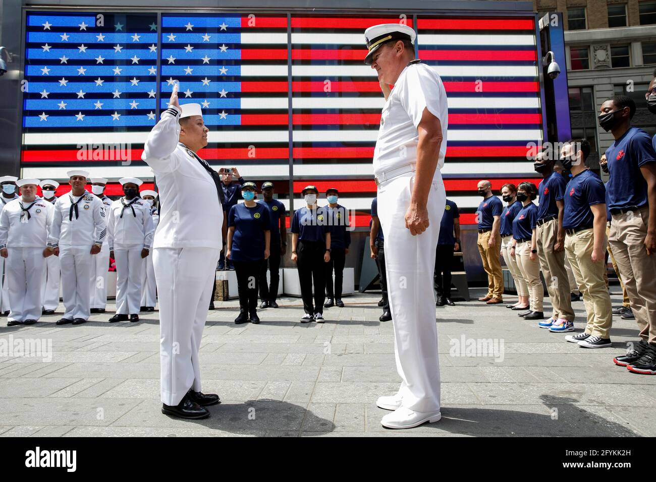 Rear Adm. Charles Rock, Commander, Navy Region Mid-Atlantic gives the oath of enlistment to Aviation Ordnanceman First Class Jessi Arnold, who re-enlisted in the Navy, in Times Square during the annual Fleet Week in New York City, U.S., May 28, 2021. REUTERS/Brendan McDermid Stock Photo