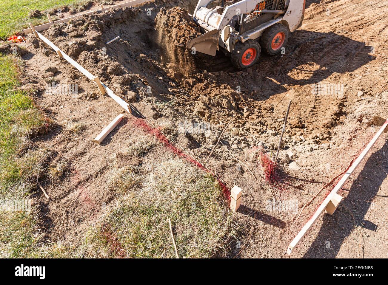 Small Bulldozer Digging In Yard For Pool Installation Stock Photo - Alamy