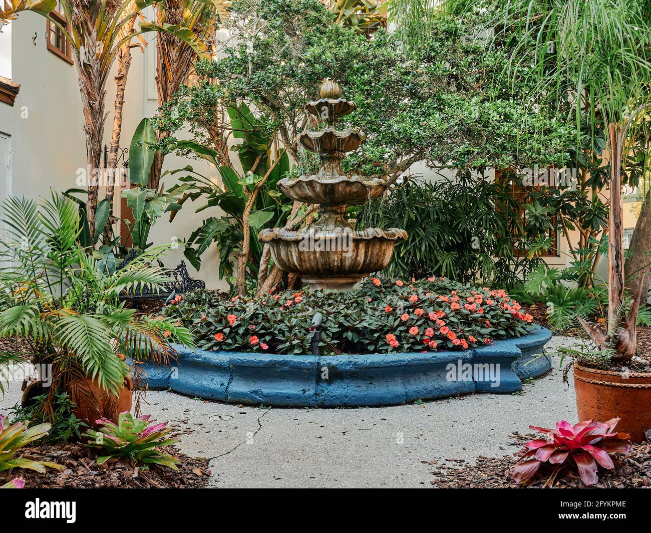 Decorative four tier garden fountain or Spanish garden fountain in a large courtyard in St Augustine Florida, USA. Stock Photo