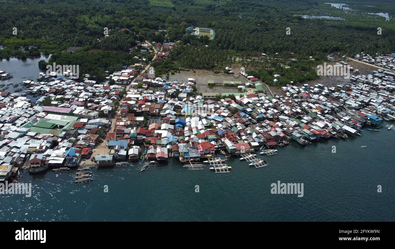 Isabela City, Philippines. 28th May, 2021. Drone image of Isabela City which was placed under General Community Quarantine (GCQ) status from May 28 to June 10, 2021 following the surge of COVID-19 cases in the city. (Photo by Sherbien Dacalanio/Pacific Press) Credit: Pacific Press Media Production Corp./Alamy Live News Stock Photo
