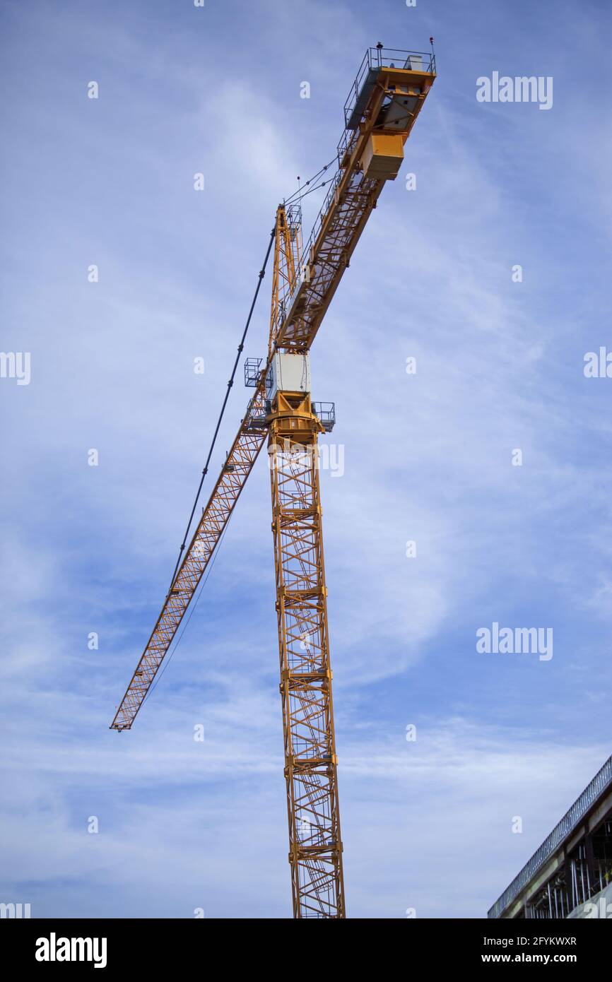 Low angle shot of a crane against the blue cloudy sky Stock Photo - Alamy