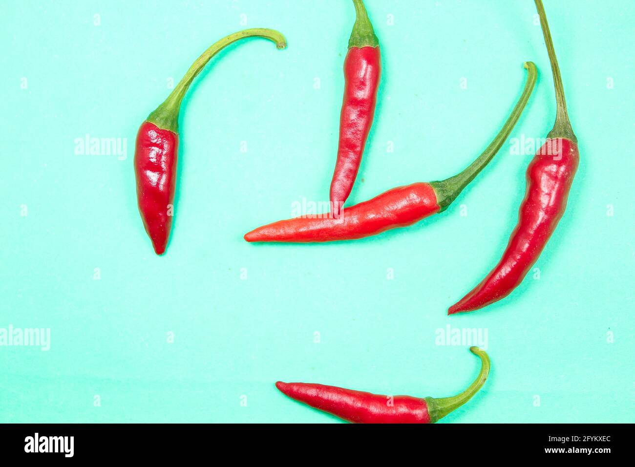 Garden fresh red chilli isolated on surface, top view Stock Photo - Alamy