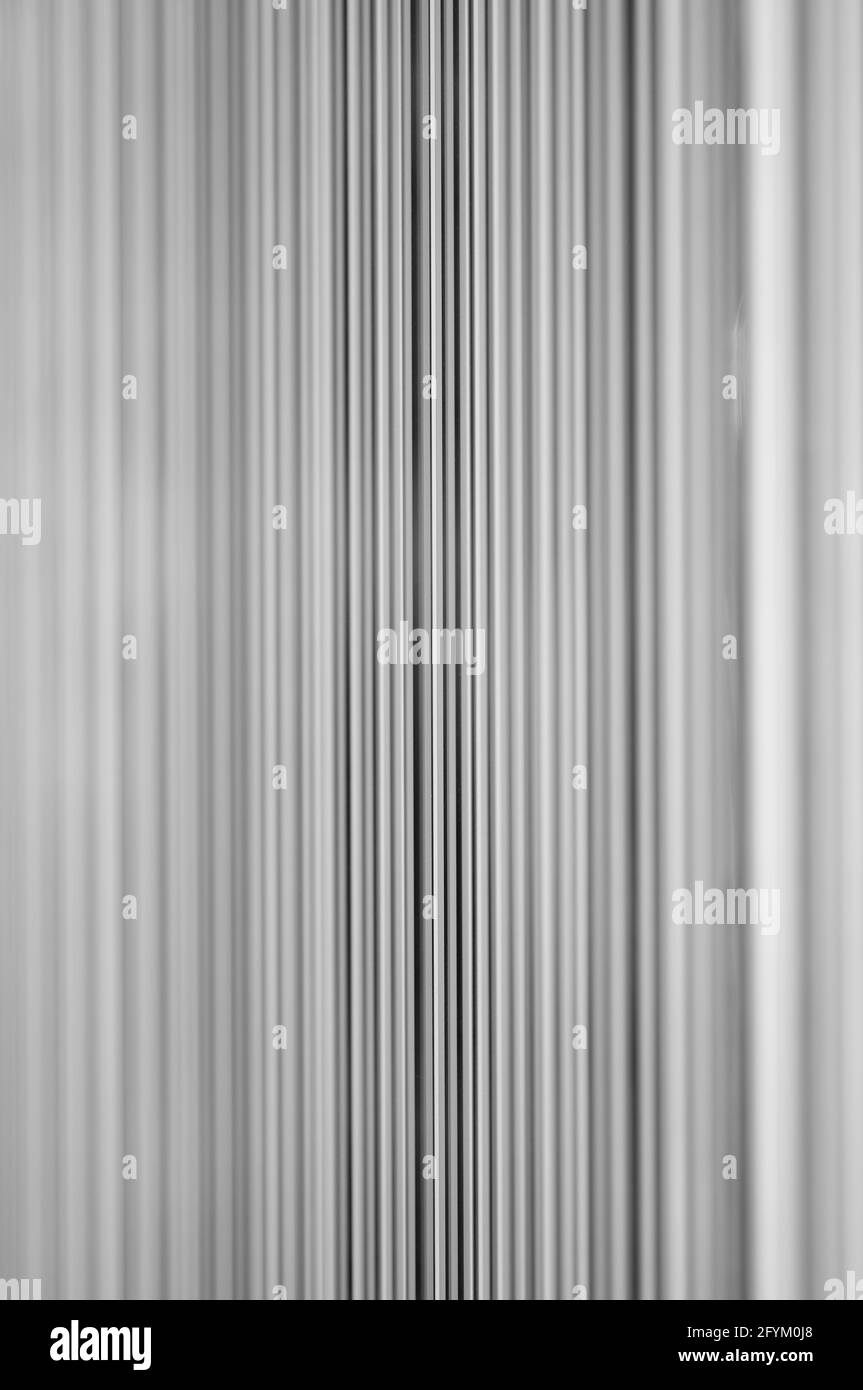 Merging Vertical Lines Black and White Background (focus on the center line) Stock Photo