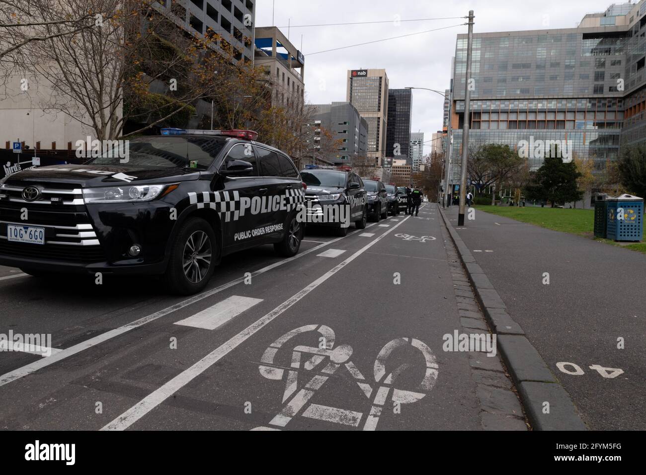 Melbourne, Australia 29 May 2021, Public order police cars on William Street during a planned 'Millions March' rally at Flagstaff Gardens, that had been canceled by organisers due to the snap lockdown. Hardcore anti-lockdown and anti-vaccination protesters still attend the park and rallied against the government. Credit: Michael Currie/Alamy Live News Stock Photo