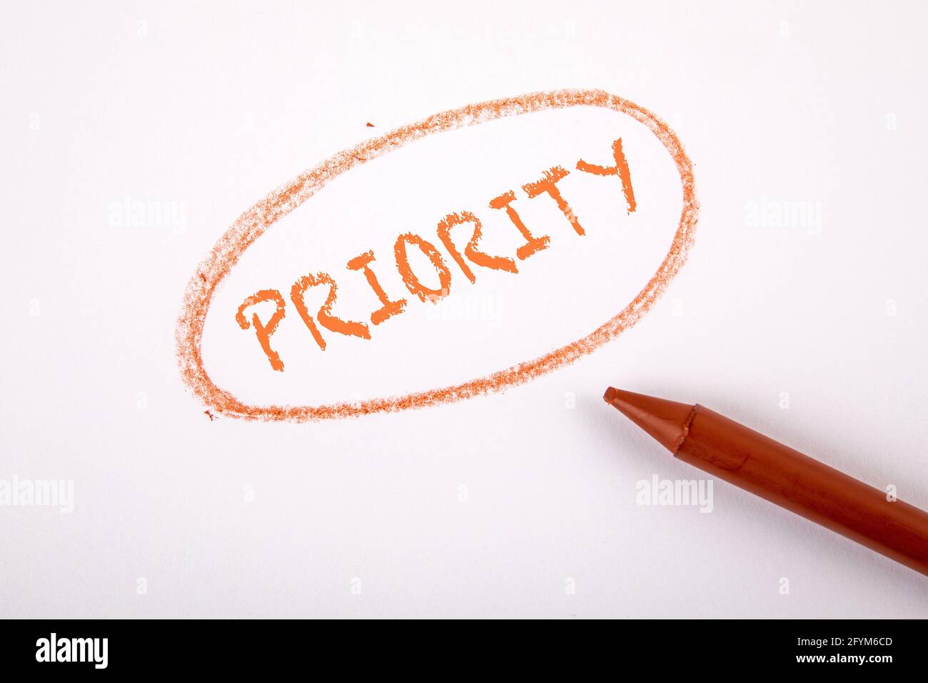 PRIORITY. Text on a white sheet of paper Stock Photo - Alamy