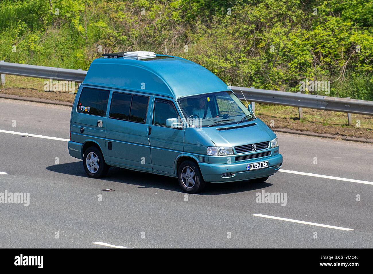 2002 blue VW Volkswagen Transporter Tdi Auto Lwb; Caravans and Motorhomes, campervans on Britain's roads, RV leisure vehicle, family holidays, caravanette vacations, Touring caravan holiday, van conversions, Vanagon autohome, life on the road,  auto-sleeper Stock Photo