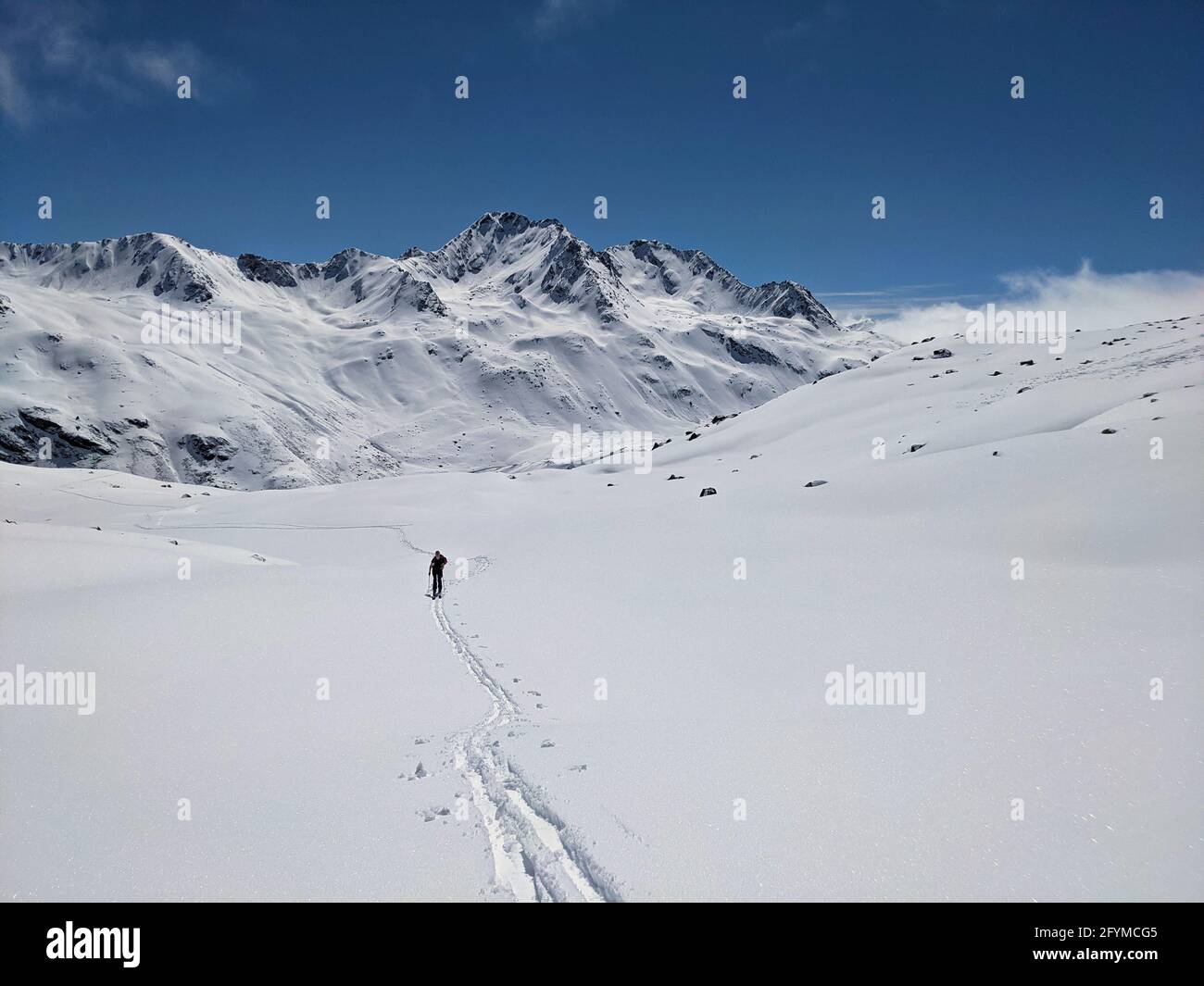 Ski mountaineering in the beautiful Swiss alps. Winter landscape in the grisons mountains near the engadin. Davos  Stock Photo