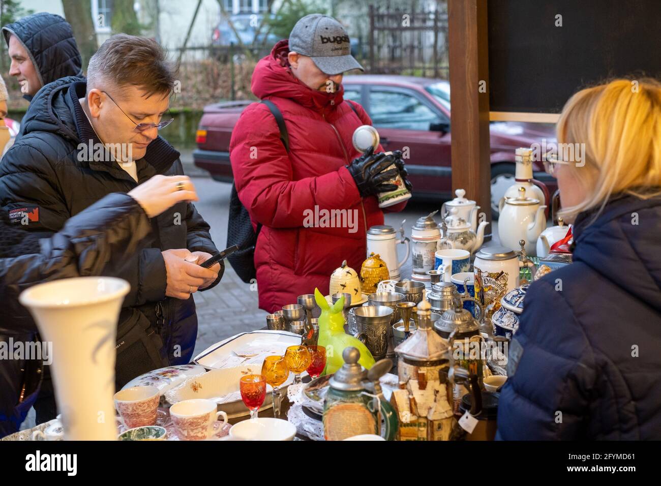 People buying souvenirs at local market Stock Photo