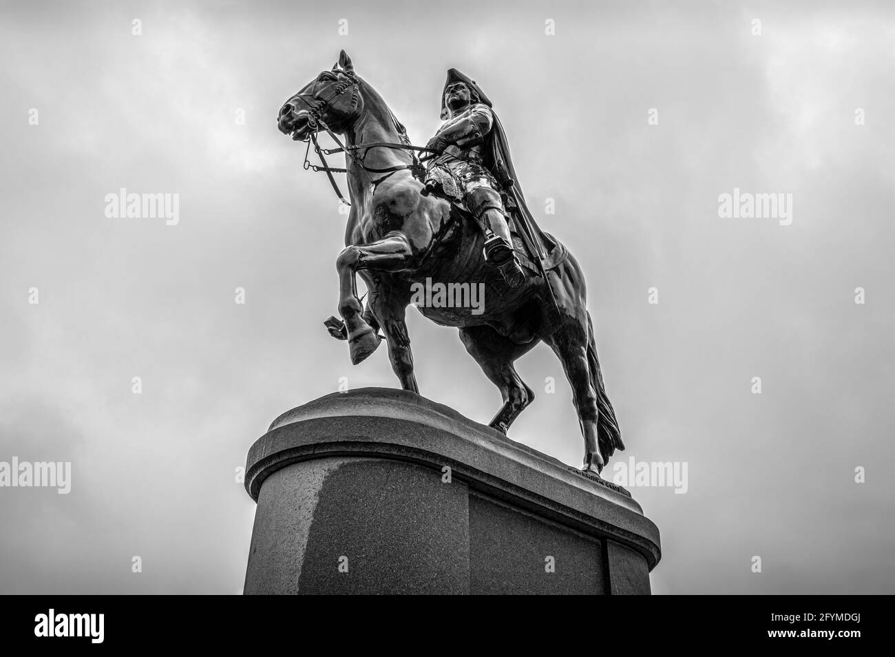 Bronze monument to Peter the Great riding a horse. Upward view. Black and white. Stock Photo