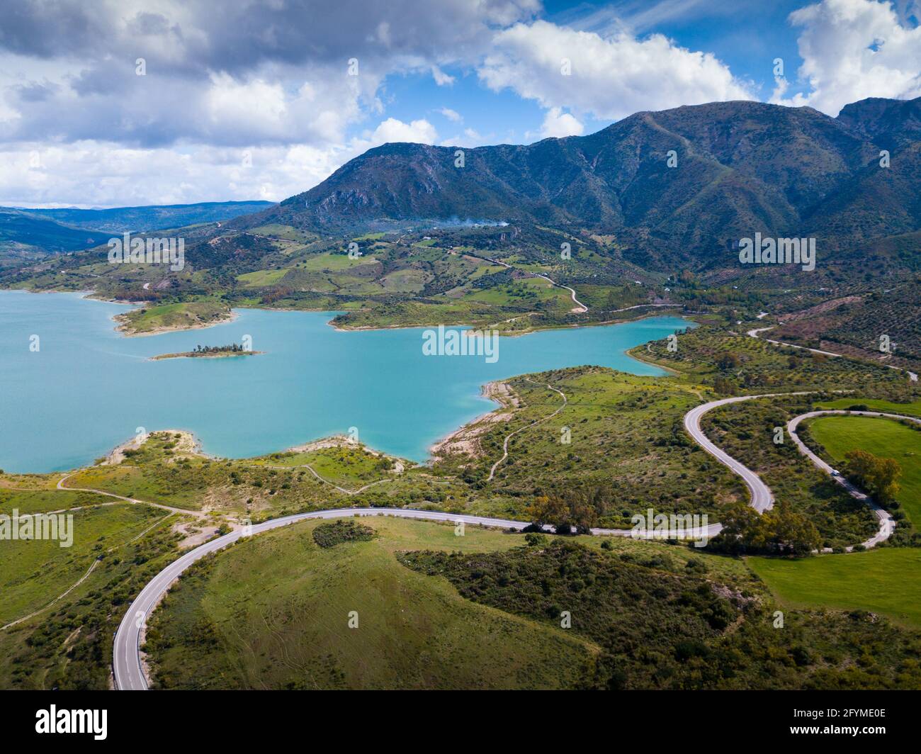 Panoramic view of Zahara lake in front of mountain range in Sierra de ...