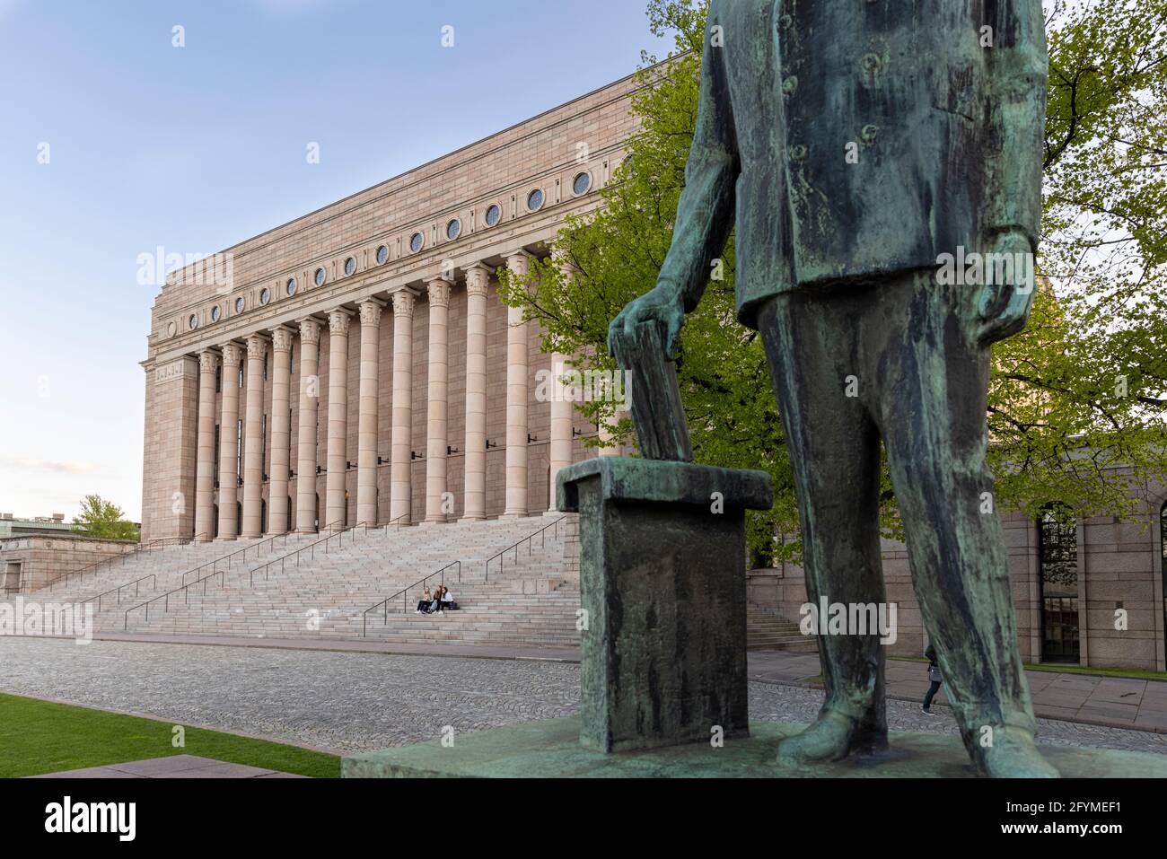 Finnish parliament building is recognisable from granite colonnade facade and statues of former presidents in front. Stock Photo