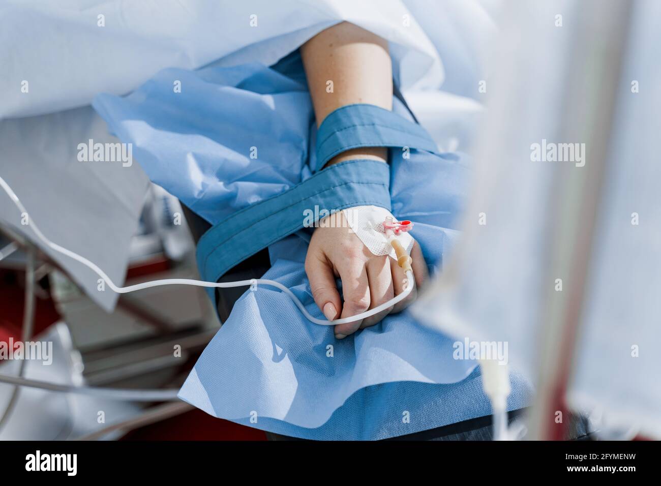 Catheter safely inserted into woman hand on plastic operation