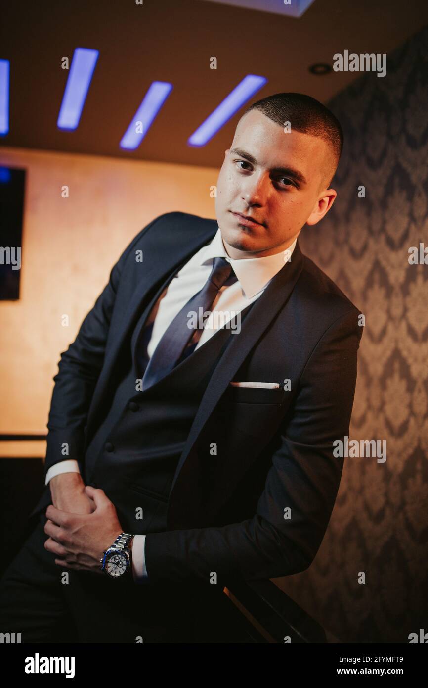 Vertical Shot Of A Handsome Bosnian Caucasian Man Wearing A Suit