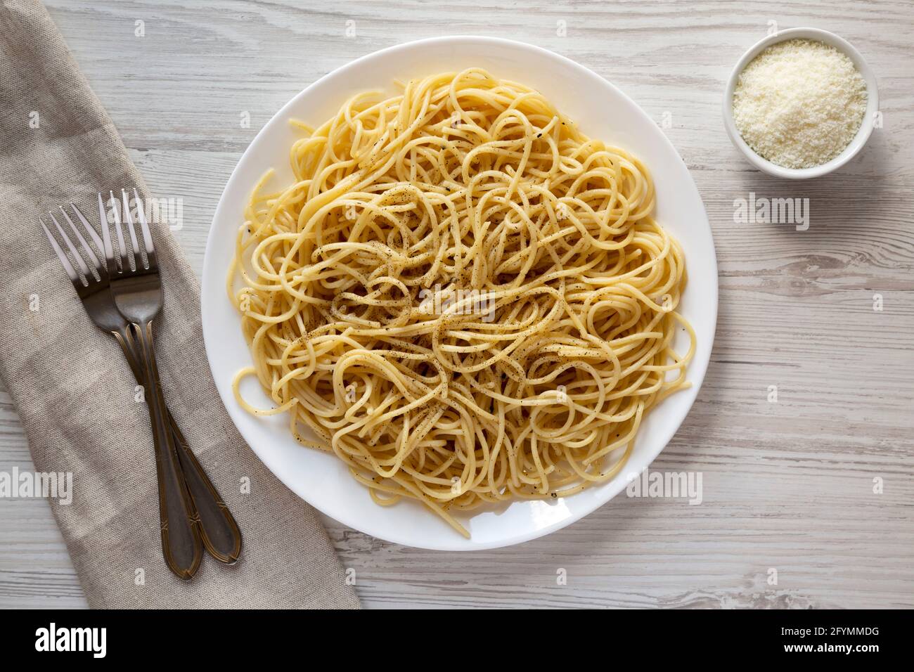 Homemade Cacio E Pepe Pasta with Pecorino Romano and Pepper on a white